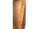 Interior view of a vintage paneled wood door in an exposed-beam attic at 201 W Rice St, Landis, NC 28088