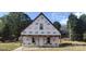 Exterior of framed house with front door, windows, and construction wrap at 201 W Rice St, Landis, NC 28088