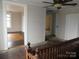 Hallway view featuring hardwood floors and neutral walls with adjoining rooms visible at 201 W Rice St, Landis, NC 28088