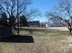 Property with a framed shed and house and sunny blue skies at 201 W Rice St, Landis, NC 28088