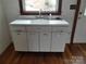 Classic utility sink with vintage cabinets and hardware, showcasing retro design at 201 W Rice St, Landis, NC 28088