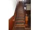 Classic wooden staircase featuring detailed banister and trim, adding character to the home at 201 W Rice St, Landis, NC 28088