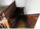 Stairwell with wood stairs and railing, going down to a basement area at 201 W Rice St, Landis, NC 28088