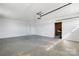 Spacious two car garage with white walls, overhead door, side door and concrete floors at 2028 Hendil St, Conover, NC 28613