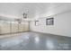 Spacious two car garage with white walls, overhead door and concrete floors at 2028 Hendil St, Conover, NC 28613