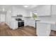 Modern white kitchen featuring new stainless steel appliances and subway tile backsplash at 2028 Hendil St, Conover, NC 28613