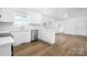Bright kitchen with stainless steel appliances and stylish flooring and access to the deck at 2028 Hendil St, Conover, NC 28613