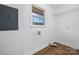 Bright laundry room with hardwood floors, window and wire shelving at 2028 Hendil St, Conover, NC 28613