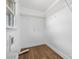 Bright laundry room with hardwood floors, window and wire shelving at 2028 Hendil St, Conover, NC 28613