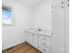 Laundry room featuring updated cabinets, countertops, and stainless steel sink at 2028 Hendil St, Conover, NC 28613