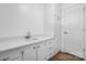 Laundry room featuring updated cabinets and countertops, and a door to the garage at 2028 Hendil St, Conover, NC 28613