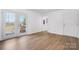 Bright living room with stylish floors and french doors leading to the deck at 2028 Hendil St, Conover, NC 28613