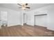 Bright main bedroom featuring new wood floors, ceiling fan, walk in closet and attached bathroom at 2028 Hendil St, Conover, NC 28613
