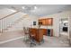 Basement wet bar with seating and stainless steel wine cooler at 213 Patternote Rd, Mooresville, NC 28117