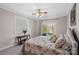 Comfortable bedroom with window and sliding glass door to lake at 213 Patternote Rd, Mooresville, NC 28117