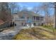Exterior of home features a spacious patio and a well-manicured lawn, perfect for entertaining at 213 Patternote Rd, Mooresville, NC 28117