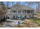 Rear elevation of home with two floors of covered patios and a lakeside patio at 213 Patternote Rd, Mooresville, NC 28117