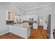 Updated kitchen with granite countertops, stainless steel appliances, and a breakfast bar with hardwood flooring at 213 Patternote Rd, Mooresville, NC 28117