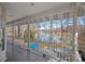 A beautiful lake view from a spacious covered porch with white railings, perfect for enjoying the scenery at 213 Patternote Rd, Mooresville, NC 28117