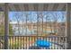 Breathtaking waterfront view of a lake from a porch with white railings and trees around at 213 Patternote Rd, Mooresville, NC 28117