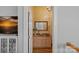 Stylish powder room featuring a decorative sink, mirror, and granite countertop at 213 Patternote Rd, Mooresville, NC 28117