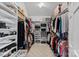 Organized walk-in closet with custom shelving and ample storage space at 213 Patternote Rd, Mooresville, NC 28117