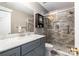 Modern bathroom featuring a gray vanity with marble countertop, and tiled glass enclosed shower at 2511 Brackley Nw Pl # 1013, Concord, NC 28027