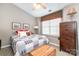 Bright bedroom with a ceiling fan, a patterned quilt, and plenty of storage space at 2511 Brackley Nw Pl # 1013, Concord, NC 28027