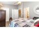 Relaxing bedroom with a ceiling fan, a patterned quilt, and convenient closet access at 2511 Brackley Nw Pl # 1013, Concord, NC 28027