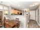 Eat-in kitchen with stainless steel appliances, breakfast bar and view to the entry foyer at 2511 Brackley Nw Pl # 1013, Concord, NC 28027