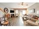 Spacious living room with hardwood floors, a fireplace, and sliding doors to the outdoor patio at 2511 Brackley Nw Pl # 1013, Concord, NC 28027
