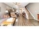 Comfortable living room featuring hardwood floors, staircase and neutral color palette at 2511 Brackley Nw Pl # 1013, Concord, NC 28027