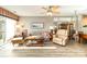 Bright living room with hardwood floors, a ceiling fan, and lots of natural light at 2511 Brackley Nw Pl # 1013, Concord, NC 28027
