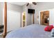 Spacious main bedroom featuring a canopy bed, ceiling fan, and convenient access to the bathroom at 2511 Brackley Nw Pl # 1013, Concord, NC 28027