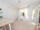 Bedroom featuring neutral carpet, a desk, shelving, mirror and access to a closet at 2520 Foxworth Dr, Monroe, NC 28110