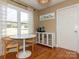 Bright breakfast nook features hardwood floors, a round table, and a view of the backyard at 2520 Foxworth Dr, Monroe, NC 28110