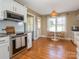 Modern kitchen with stainless steel appliances, granite countertops, and a cozy breakfast nook with natural light at 2520 Foxworth Dr, Monroe, NC 28110