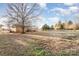 Sprawling backyard with mature tree, offering a serene setting and ample space for recreation at 2888 Robinson Rd, Newton, NC 28658
