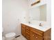 Bathroom featuring a dual sink vanity with a large mirror and ample lighting at 2888 Robinson Rd, Newton, NC 28658