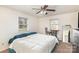 Comfortable bedroom featuring a ceiling fan, two windows, and space for a table and chairs at 2888 Robinson Rd, Newton, NC 28658