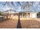 A single story home with brick and vinyl siding, a covered porch, and an attached garage at 2888 Robinson Rd, Newton, NC 28658