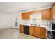 Functional kitchen featuring wood cabinets, a stainless steel sink and a door to the exterior at 2888 Robinson Rd, Newton, NC 28658
