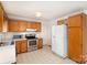 Efficient kitchen with wooden cabinetry, stainless steel appliances, and white countertops at 2888 Robinson Rd, Newton, NC 28658