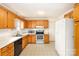 Cozy kitchen featuring wood cabinets, laminate countertops, and stainless steel appliances at 2888 Robinson Rd, Newton, NC 28658