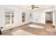A spacious, light-filled living room with carpet flooring, with large windows at 2888 Robinson Rd, Newton, NC 28658