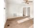 The living room has neutral-colored carpet and white painted walls and trim at 2888 Robinson Rd, Newton, NC 28658