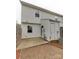Backyard features a wooden fence, a concrete patio and AC unit at 307 French St, Charlotte, NC 28216