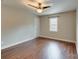 Bedroom featuring hardwood floors, neutral paint, natural light and door to hall at 307 French St, Charlotte, NC 28216