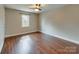 Bedroom featuring hardwood floors, a ceiling fan, natural light and neutral paint at 307 French St, Charlotte, NC 28216