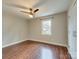 Bedroom featuring hardwood floors, a ceiling fan, natural light and a closet at 307 French St, Charlotte, NC 28216